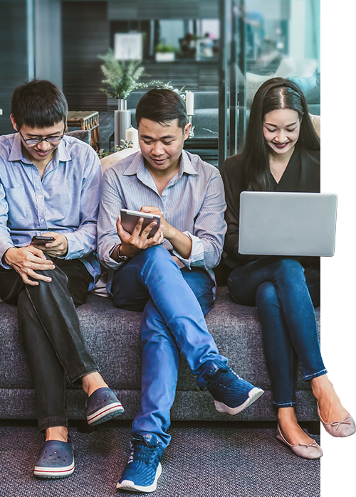 Three people sit shoulder to shoulder on a low couch, each using a different mobile device equipped with Mobile 1 workflow solutions